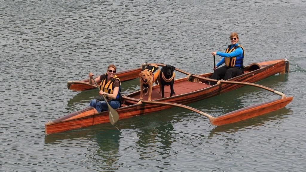 Dog and person on outrigger in Big River