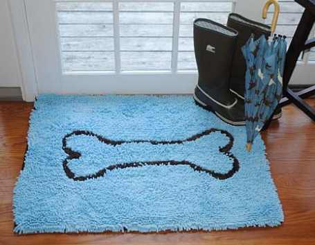 blue door mat with a dog bone on it