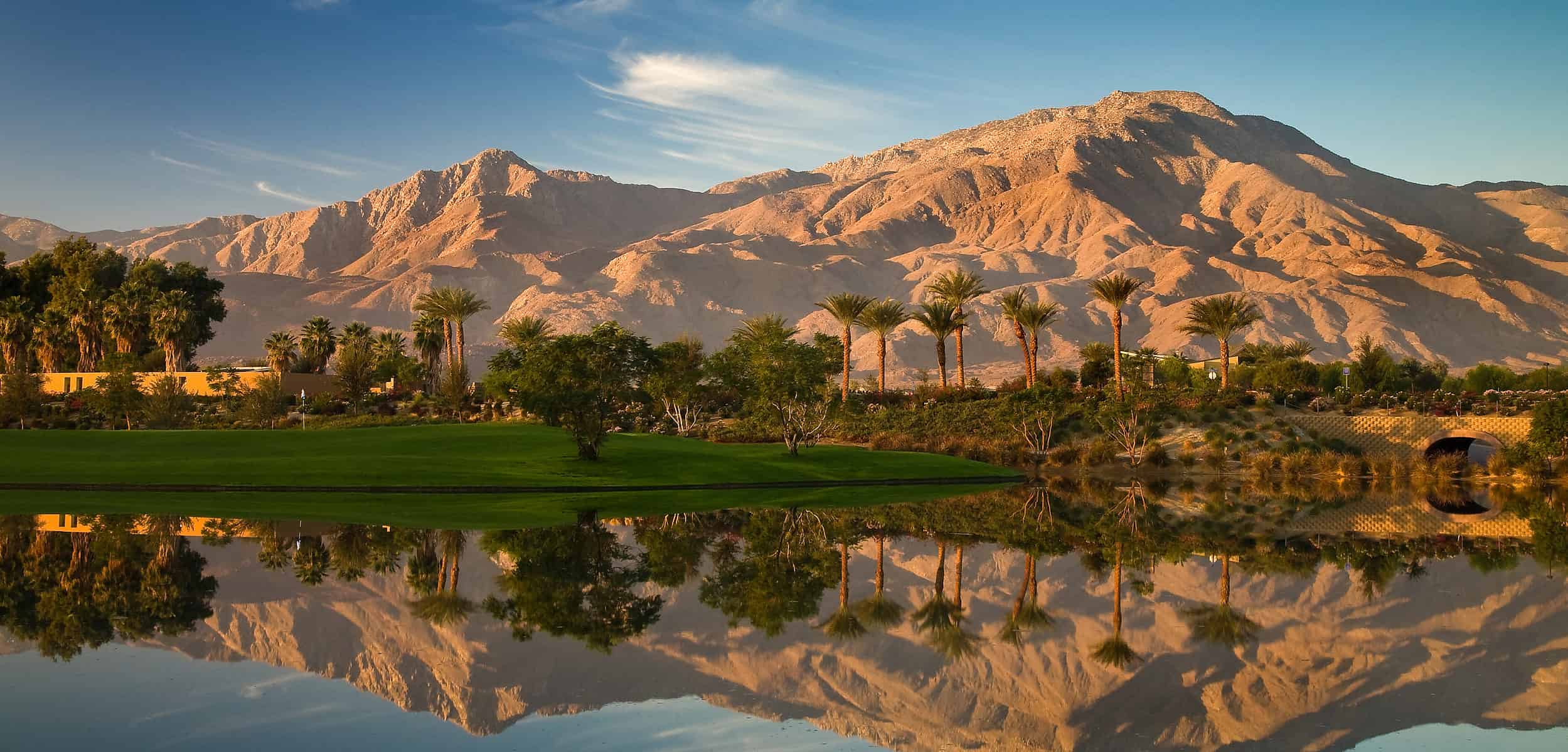 mountains reflected in mirror-like lake