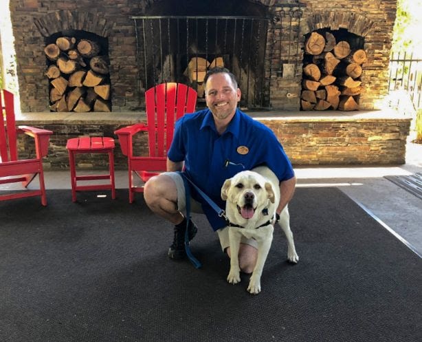 Dog and person in Tenaya Lodge lobby